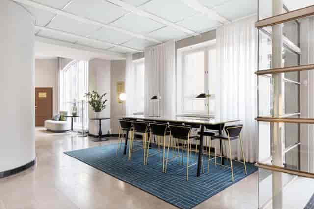 Modern Radisson Blu Aleksanteri hotel meeting room, ideal for corporate events and networking.