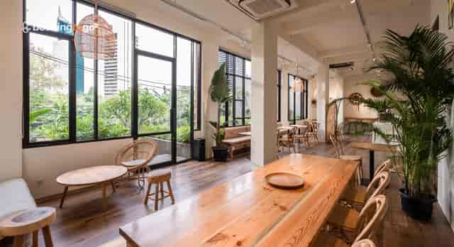 Lobby Cafe at Cafe Jakarta with biophilic decor, ideal for casual networking and business meetings.