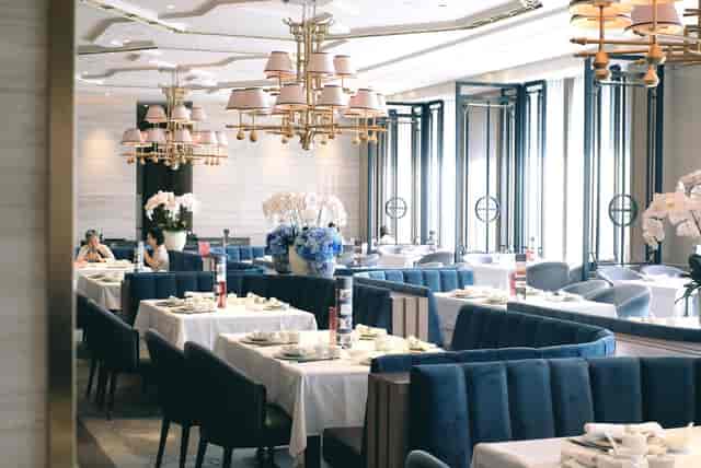 House of Yuen restaurant featuring navy velvet banquettes for corporate luncheons and VIP dinners.
