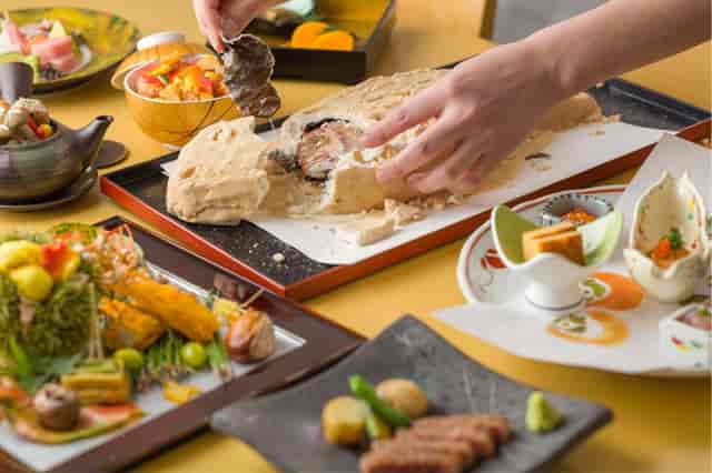 Tableside service at SENSHU restaurant, a premium interactive dining experience for luxury events.