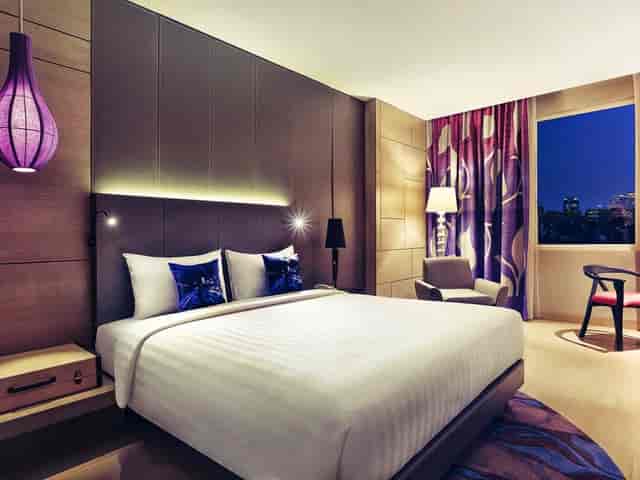 Grand Sabang guest room at Mercure Jakarta, modern hotel lodging for business conference travel.