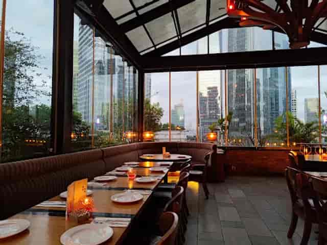Yoshi Izakaya sake bar with glass city views, ideal for upscale cocktail hours and networking events.