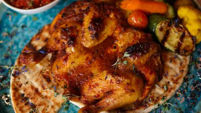 Grilled chicken and roasted vegetables at Gulawatu Restaurant, ideal for conference dinner catering.