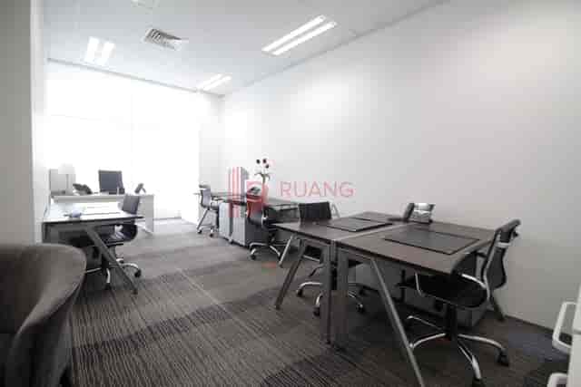 Co-working space at Sahid Sudirman Center with neutral decor for professional meetings and office use.