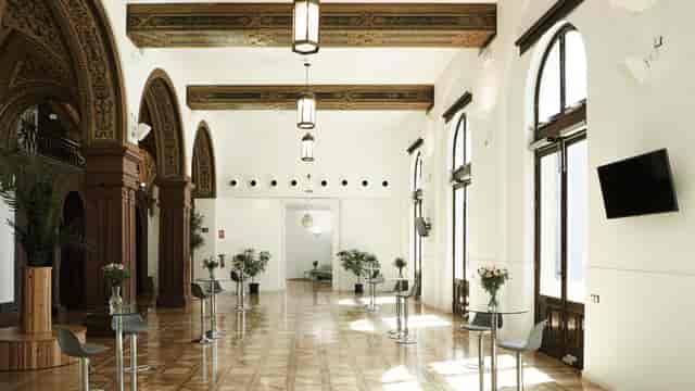 Stylish Trocadero venue with arched windows, perfect for networking events and receptions.