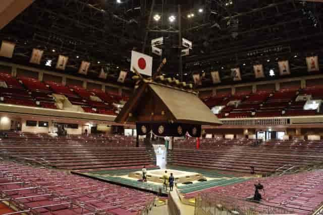 Kokugikan Arena with suspended architectural ceiling for 360-degree event and concert staging.