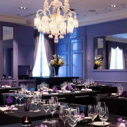 Luxury Chateau Restaurant banquet hall with crystal chandelier for gala dinners and corporate events.