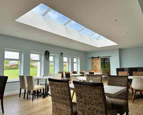 Cammies Restaurant airy event space with natural light for networking and breakfast briefings.