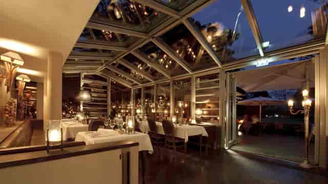 Diwan at Gerbermühle glass-enclosed venue for intimate evening reception events.
