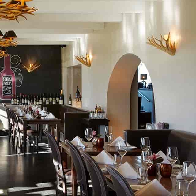 Rustic Gerbermühle restaurant with banquette seating for corporate dinners and VIP events.