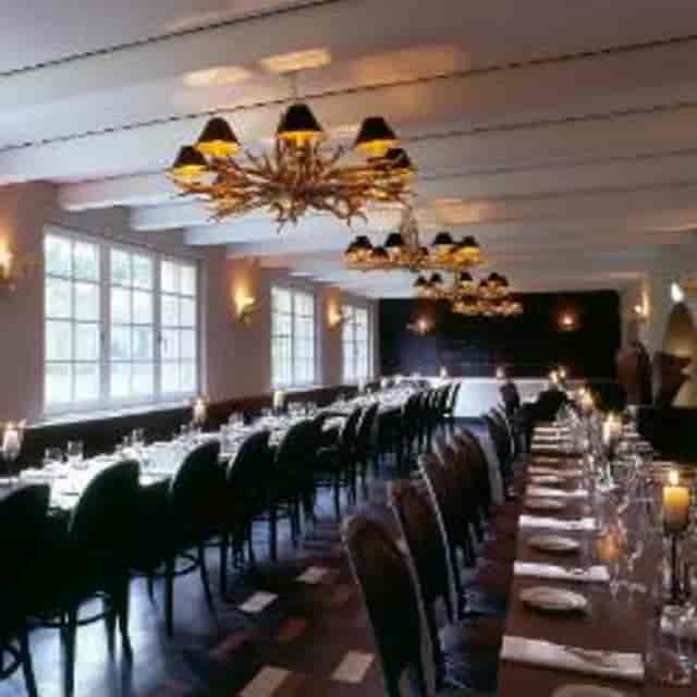 Private dining room with antler chandeliers for corporate dinner or intimate banquet events.