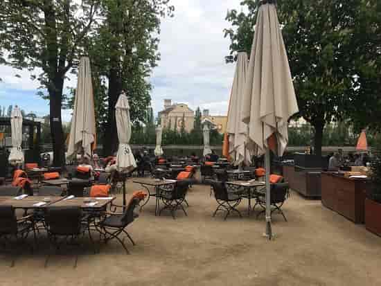 Outdoor event space at Gerbermühle with bistro seating for networking receptions and group dining.
