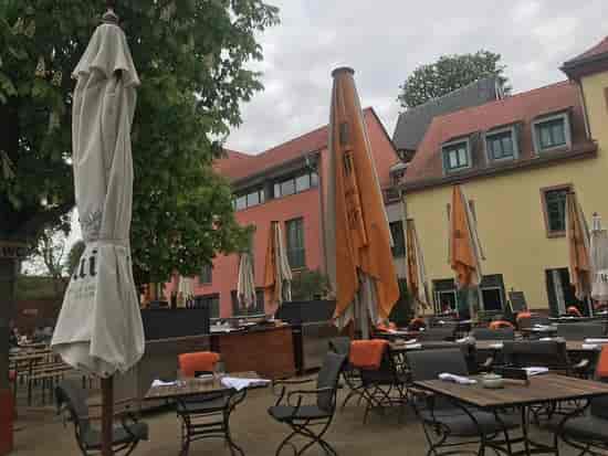 Gerbermühle outdoor breakout space with patio seating for corporate events and workshops.