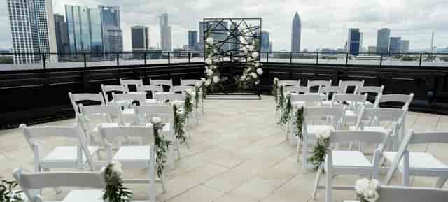 Westend Tower rooftop ceremony: industrial-chic wedding venue with elegant skyline views.