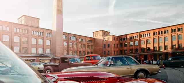 Industrial-chic courtyard at Klassikstadt for car shows and corporate brand events.