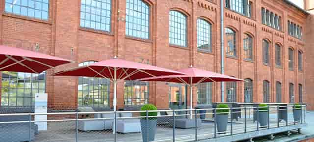 Industrial-chic courtyard at Klassikstadt, ideal for corporate networking and business receptions.