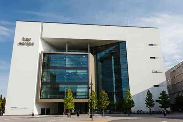 Modern Kap Europa conference room exterior, sleek professional venue for corporate event launches.