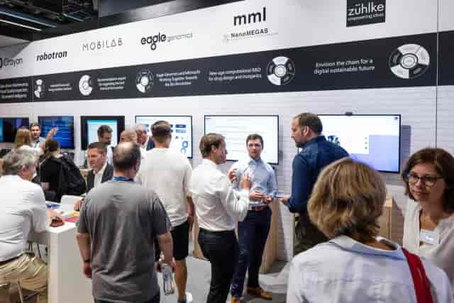 ACHEMA Hall 5.0 trade show booth with digital displays for business networking and exhibitions.