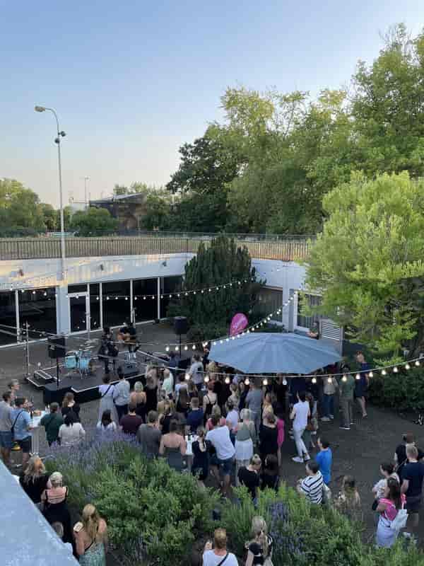 Kasino myticket Jahrhunderthalle Frankfurt outdoor networking event with stage and string lights.