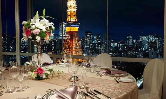 VIP dinner suite at The Prince Park Tower Tokyo with iconic floor-to-ceiling Tokyo Tower view.