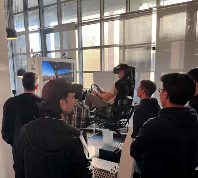 VR racing motion simulator for corporate event networking and experiential activation.