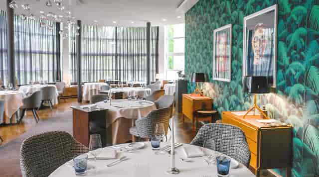 Upscale Restaurant Lafleur event space with textured decor for corporate dinners and VIP meetings.