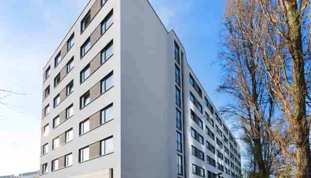 Hotel Frankfurt Messe exterior: modern corporate building for business events and meetings.