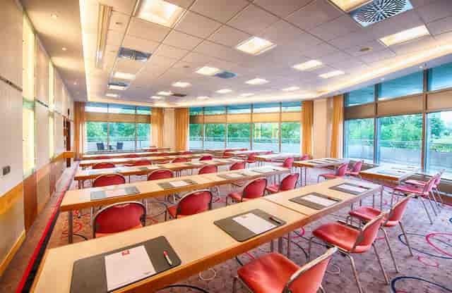 Classroom-style meeting room at Leonardo Royal Hotel Frankfurt, perfect for corporate conferences.