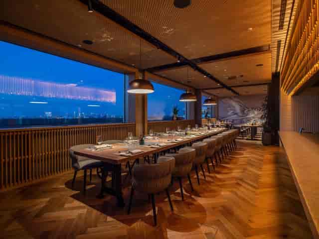 Private dining room at The Roof with city view for executive dinners and board retreats.