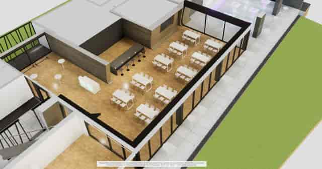 Classroom-style corporate workshop space at FRALounge with bar for events and business meetings.