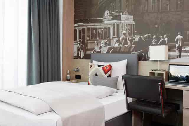 Modern Living Hotel Frankfurt lounge with workspace for business meetings and corporate events.