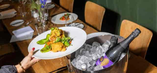 Gourmet banquet service with chilled wine at Courtyard Terrace, Margarete for premium events.