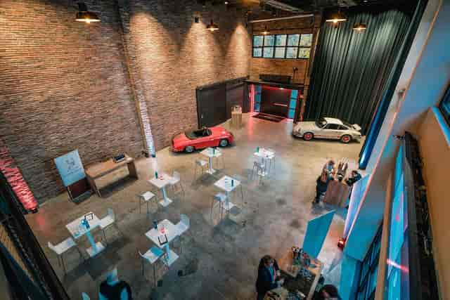 Industrial-chic Vintage Loft venue for corporate receptions with iconic car displays.