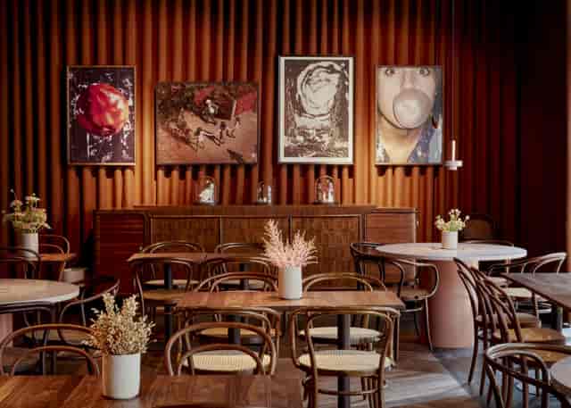 Intimate breakout space with velvet curtains for high-end corporate meetings and workshops.