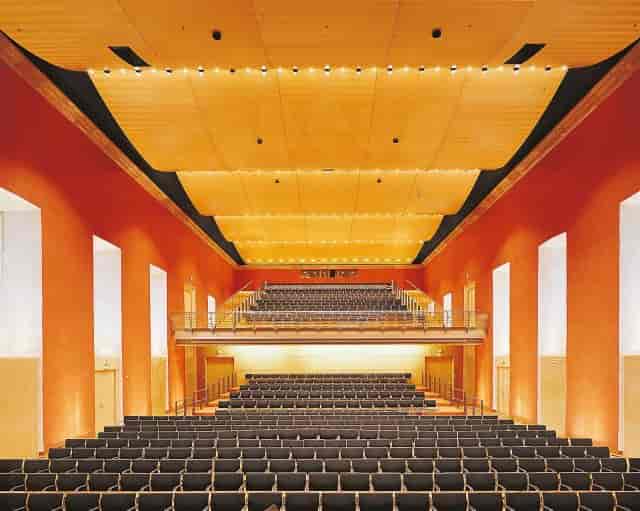 Comoedienhaus auditorium with tiered seating for corporate presentations and award ceremonies.