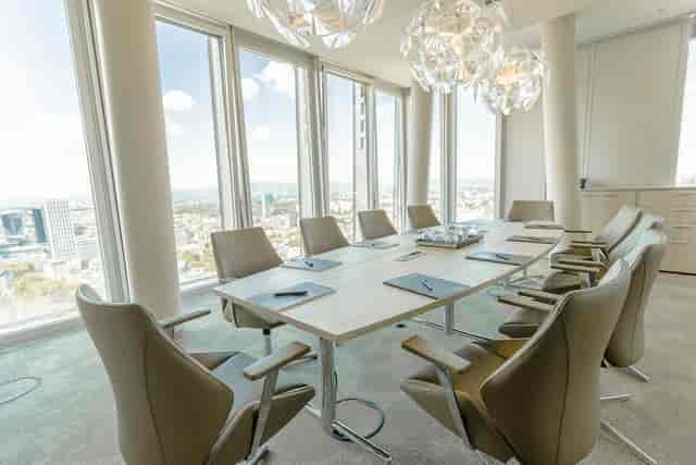 Modern boardroom with skyline view for executive meetings and corporate conferences.