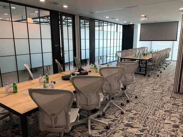 Modern boardroom at Ocean Financial Centre with wood tables for executive corporate meetings.