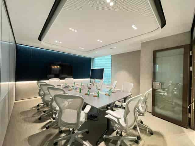 Modern executive boardroom with ergonomic seating for corporate meetings and client presentations.