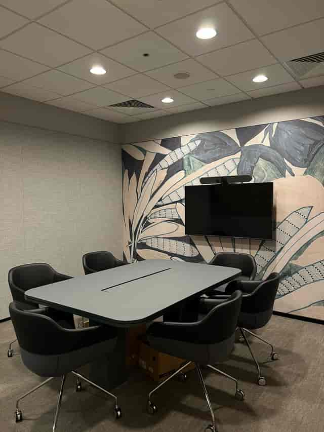 Modern Singapore Land Tower huddle room with AV system for hybrid meetings and corporate events.