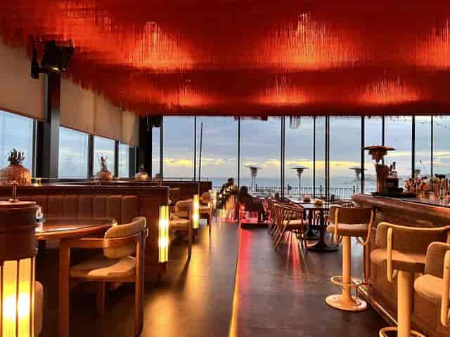 Jigger Kitchen & Bar sunset venue with fringe ceiling for networking and cocktail events.