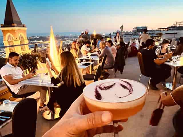 Rooftop networking reception at 360 Istanbul with golden hour skyline views.