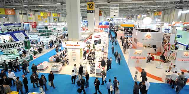 Istanbul Fuar Merkezi trade show floor with island booths for corporate exhibition and event planning.