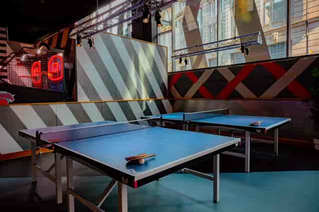 Vibrant ping pong tables at Roxy Ball Room, ideal for team-building events in Manchester.