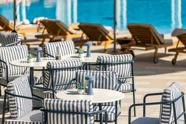Sadirvan Terrace at Hilton Istanbul: Outdoor networking lounge with navy-striped decor.