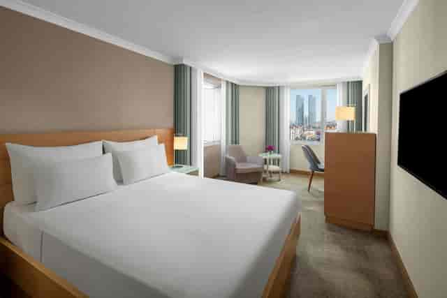 Standard guest room at Dedeman Istanbul with workspace for business travel.