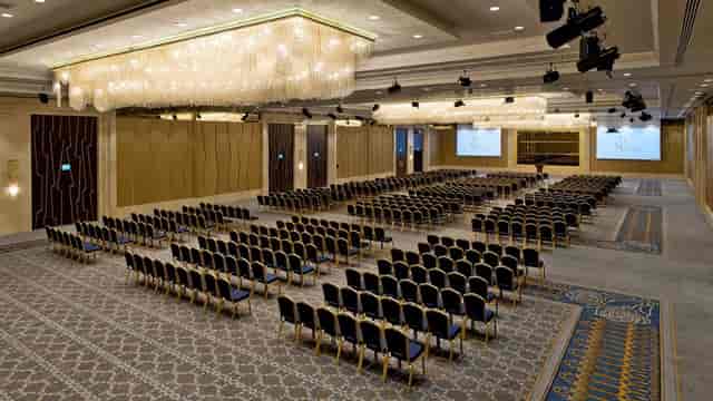 Grand Tarabya Hotel ballroom with theater-style seating for corporate plenary event.