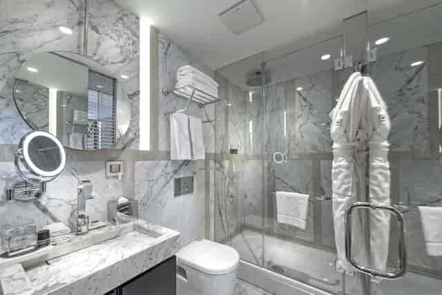 Luxury hotel bathroom with marble interior for executive retreats and VIP accommodations.