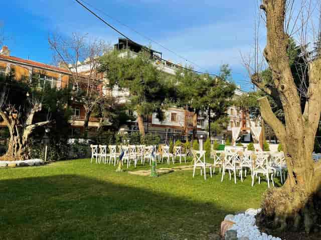 Zümrüt Bahçe garden wedding ceremony with cross-back chairs, outdoor event venue.