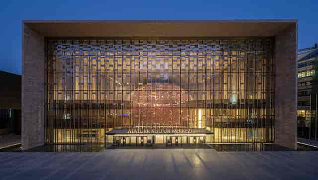 Modern AKM auditorium with illuminated architecture for corporate events and galas.