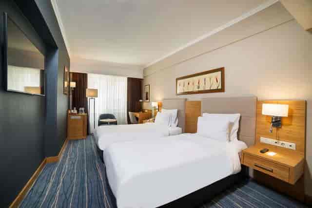 Modern Radisson Old Town Istanbul hotel room, twin occupancy, ideal for business conference travel.